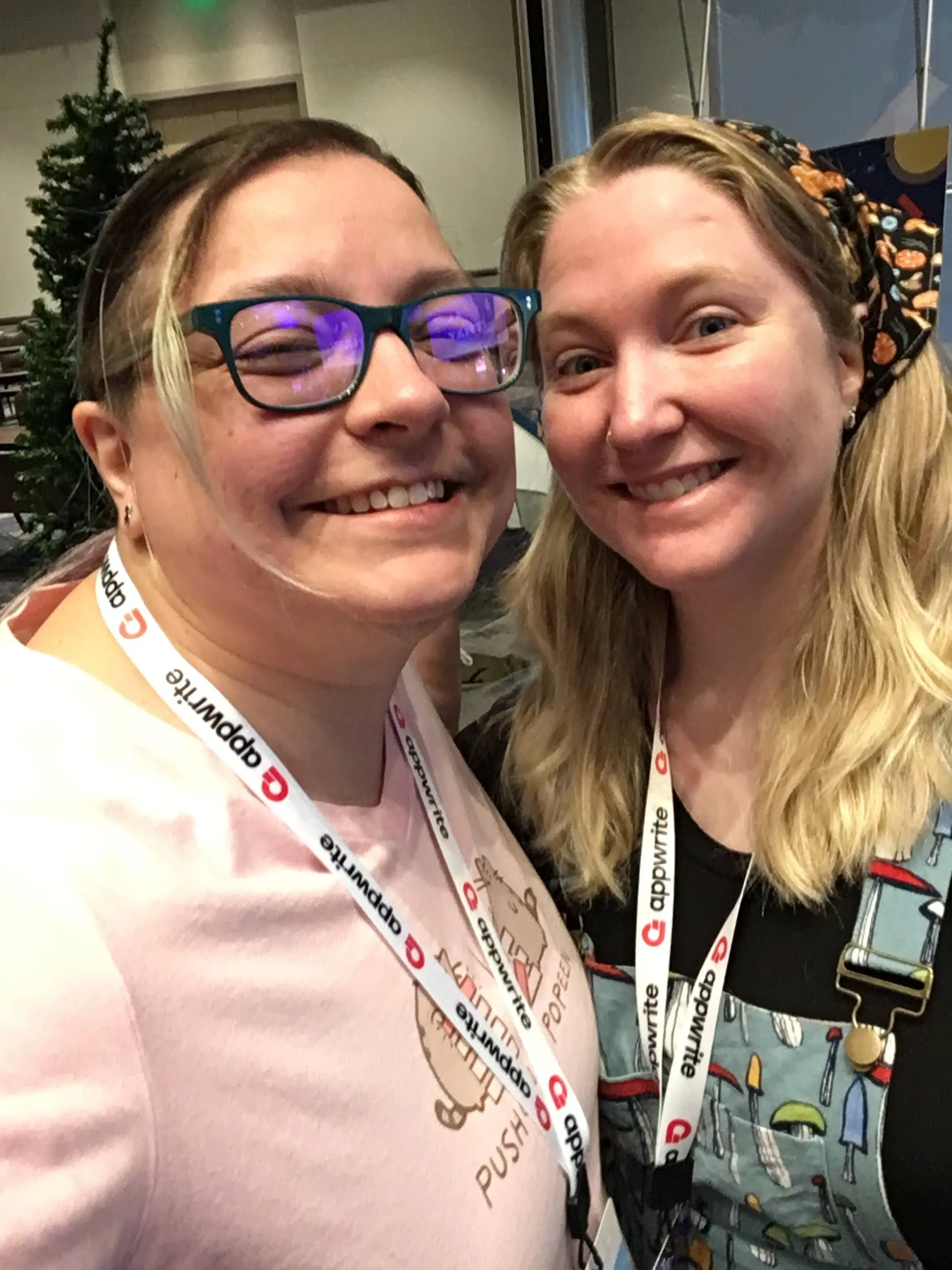 Linda and Abbey stand next to each other, smiling at the camera.